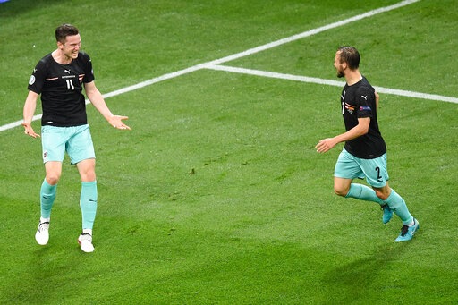 Austria's Michael Gregoritsch, left, celebrates after scoring his side's 2nd goal during the Euro 2020 match. Austria's Michael Gregoritsch, left, celebrates after scoring his side's 2nd goal during the Euro 2020 match.