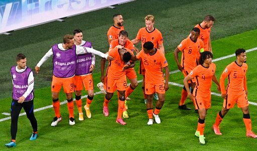 Netherlands' Denzel Dumfries, center, celebrates scoring their third goal. Netherlands' Denzel Dumfries, center, celebrates scoring their third goal.
