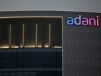 The logo of the Adani Group is seen on the facade of one of its buildings on the outskirts of Ahmedabad.