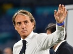 Italy coach Roberto Mancini celebrates after the match.