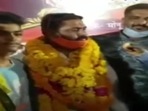 BJP Yuva Morcha district president Mridul Dwivedi along with his guests were seen without masks in public and was not following the social distancing norms.(ANI Photo)