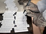 Kolhapur had reported 133,309 total positive cases of the Covid-19 disease. In picture - A health worker with Covid-19 swab samples.(PTI | Representational image) Kolhapur had reported 133,309 total positive cases of the Covid-19 disease. In picture - A health worker with Covid-19 swab samples.(PTI | Representational image)