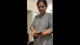 Chabi Gupta's mom inspects her Gucci belt 