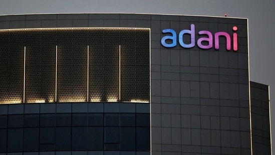 The logo of the Adani Group is seen on the facade of one of its buildings on the outskirts of Ahmedabad.(Reuters File Photo)