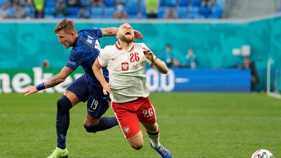 Slovakia's Juraj Kucka in action with Poland's Tymoteusz Puchacz. (Pool via REUTERS)