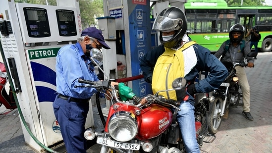 A petrol station employee fills a bike with petrol in India on Friday. (ANI Photo) A petrol station employee fills a bike with petrol in India on Friday. (ANI Photo)