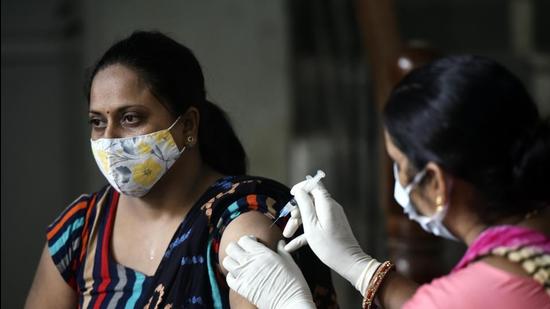 A woman gets her Covid vaccine at a polyclinic in Sector 31 in Gurugram on Thursday, June 10. (HT file) A woman gets her Covid vaccine at a polyclinic in Sector 31 in Gurugram on Thursday, June 10. (HT file)