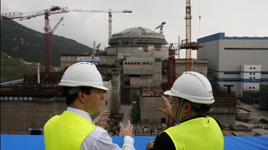In this October 17, 2013 photo, then British chancellor of the exchequer George Osborne (left) chats with Taishan Nuclear Power Joint Venture Co Ltd general manager Guo Liming as he inspects a reactor under construction at the nuclear power plant in Taishan, southeastern China's Guangdong province. (AP) In this October 17, 2013 photo, then British chancellor of the exchequer George Osborne (left) chats with Taishan Nuclear Power Joint Venture Co Ltd general manager Guo Liming as he inspects a reactor under construction at the nuclear power plant in Taishan, southeastern China's Guangdong province. (AP)
