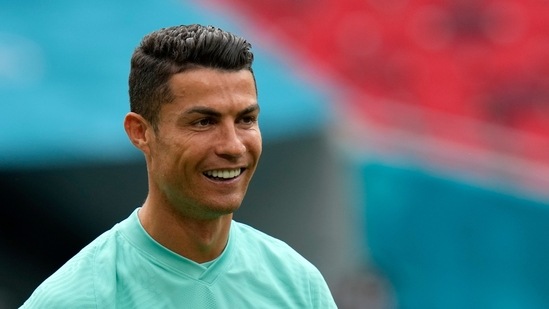Portugal's Cristiano Ronaldo smiles during a team training session at the Ferenc Puskas stadium in Budapest.(AP)