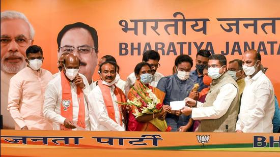 Former Telangana health minister Eatala Rajender and others being greeted as they join BJP in New Delhi on Monday. (ANI)