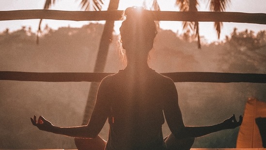 Meditation: Reduce stress hormones by practising yoga regularly. This will help promote sleep, increase awareness, relax the body, and calm the mind.(Unsplash)