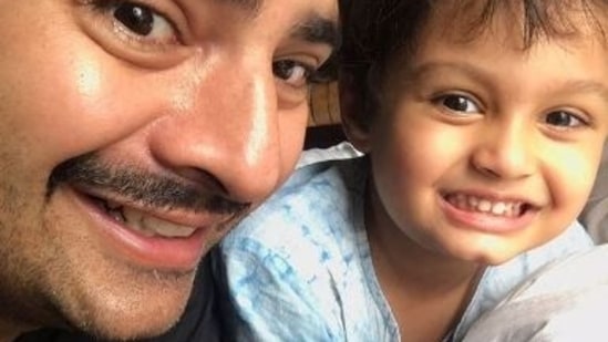 Karan Mehra poses with son Kavish. He has been accused of domestic violence by wife Nisha Rawal.