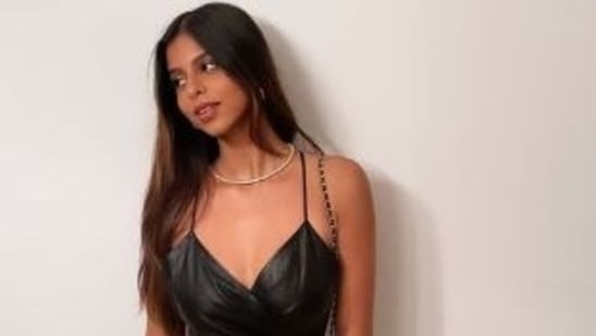 Suhana Khan poses in a sleek black dress for Instagram. 