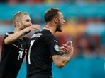 Austria's Marko Arnautovic (R) celebrates after scoring his side's third goal during against Northern Macedonia