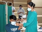 A medical professional administers an anti-Covid vaccine to a youth at Rohtak PGIMS. (HT file) A medical professional administers an anti-Covid vaccine to a youth at Rohtak PGIMS. (HT file)