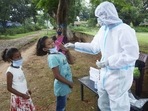 A health worker collects swab sample of a child for Covid-19 test, amid second wave of the pandemic, in Ranchi.(PTI) A health worker collects swab sample of a child for Covid-19 test, amid second wave of the pandemic, in Ranchi.(PTI)