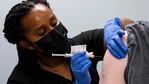 FILE - In this Wednesday, March 31, 2021 file photo, Cole Smith receives a Moderna variant vaccine shot from clinical research nurse Tigisty Girmay at Emory University's Hope Clinic in Decatur, Ga. (AP) FILE - In this Wednesday, March 31, 2021 file photo, Cole Smith receives a Moderna variant vaccine shot from clinical research nurse Tigisty Girmay at Emory University's Hope Clinic in Decatur, Ga. (AP)