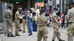 Members of the armed forces speak to people, outside a mobile Covid-19 vaccination centre, in Bolton, England.(AP File Photo) Members of the armed forces speak to people, outside a mobile Covid-19 vaccination centre, in Bolton, England.(AP File Photo)