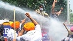 Akali Dal workers face water cannon as they demand state health minister's resignation. (Keshav Singh/HT Photo) Akali Dal workers face water cannon as they demand state health minister's resignation. (Keshav Singh/HT Photo)