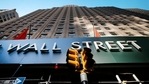 A sign for a Wall Street building is shown, (AP file photo) A sign for a Wall Street building is shown, (AP file photo)