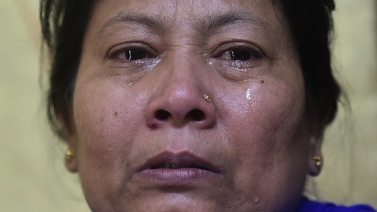 Kalpana Sinha breaks down while speaking about her husband, who died of Covid-19 during the second wave, in New Delhi on May 6. "He had a low-grade fever and a slight cough, which got better in a few days, but one morning he suddenly collapsed. Although we managed to revive him then… after scrambling for an ambulance and a bed for hours, by the time we reached the hospital, we had lost him," Kalpana told PTI.(Arun Sharma / PTI)