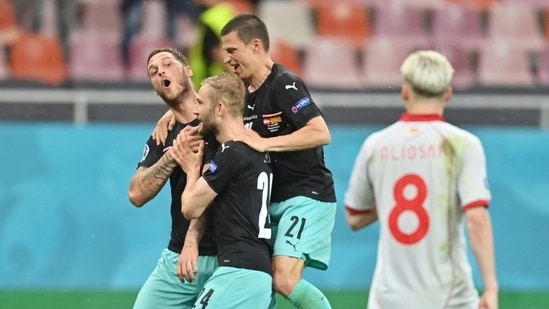 Austria's Marko Arnautovic celebrates scoring their third goal with Konrad Laimer and Stefan Lainer Pool via REUTERS/Daniel Mihailescu(Pool via REUTERS)