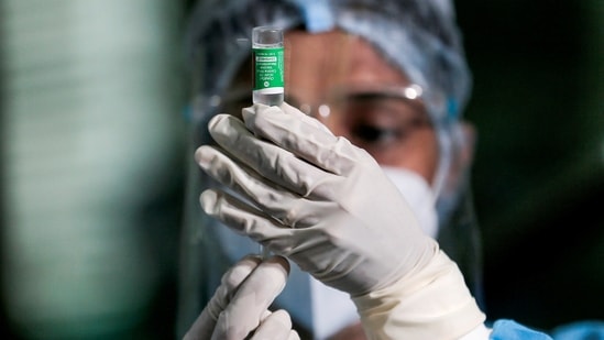 A health official draws a dose of Covid-19 vaccine.(REUTERS)