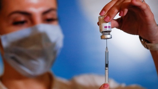 A member of the Armed Forces prepares a dose of the AstraZeneca coronavirus disease (Covid-19) vaccine in Buenos Aires, Argentina.(Reuters)