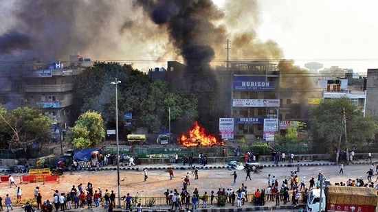 Protesters seen at the site of clashes, at Yamuna Vihar.