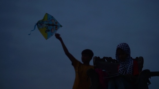 Three siblings flying a kite in New Delhi on May 5. Earlier this month, BBA also sought the Delhi High Court's assistance to get information on children who have been orphaned during the pandemic in Delhi. "While our workers have been trying to locate and provide relief to such children by giving them food and shelter wherever necessary, it is important to understand that our organisation too has limitations,” Manish Sharma, Director, Bachpan Bachao Andolan told PTI.(Arun Sharma / PTI)