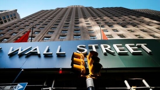 A sign for a Wall Street building is shown, (AP file photo)
