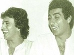 Mithun Chakraborty and Raj Babbar share a light moment in this throwback picture. Mithun Chakraborty and Raj Babbar share a light moment in this throwback picture.