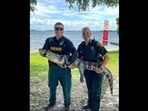 A picture of the two cops along with the alligator