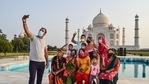 A man takes a selfie with his family at Taj Mahal that reopened after authorities eased restrictions in the ongoing Covid-19 lockdown, in Agra, on June 16. A man takes a selfie with his family at Taj Mahal that reopened after authorities eased restrictions in the ongoing Covid-19 lockdown, in Agra, on June 16.