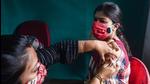 A medic administers a dose of the Covid-19 vaccine to a woman at a vaccination centre in Kolkata on June 10. (PTI) A medic administers a dose of the Covid-19 vaccine to a woman at a vaccination centre in Kolkata on June 10. (PTI)