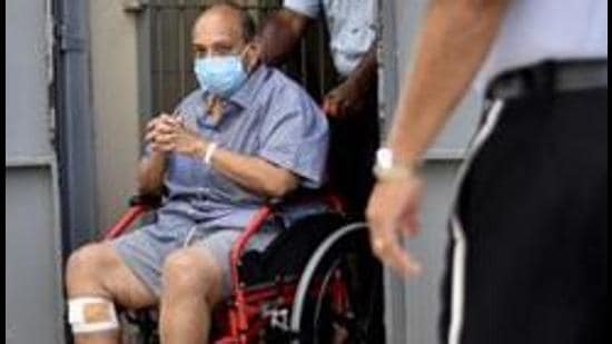Mehul Choksi exits in a wheelchair the magistrate's court in Roseau, Dominica, on June 4. (File photo)