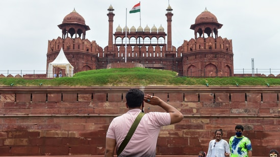 A man salutes the Indian National flag at Red Fort in New Delhi on June 16. According to ASI, visitors will be able to book entry tickets online and no offline booking facility has been made available.(Kamal Kishore / PTI)