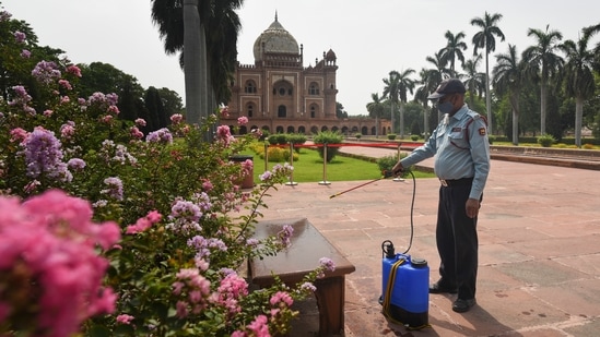 A worker chemically disinfects the premises at Safdarjung Tomb, in New Delhi, on June 15. The ASI order has mandated strict compliance with the executive orders, if any, issued by the state, district or the disaster management authority, HT reported.(Sanchit Khanna / HT Photo)