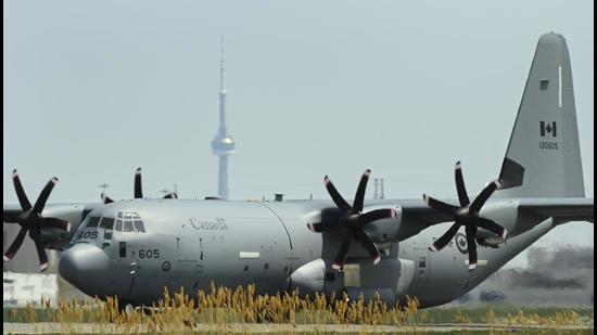 Military personal along with civilian doctors and nurses arrive in a Lockheed Martin C-130J Super Hercules turboprop military transport aircraft at Pearson International Airport in Toronto, Canada. (AP) Military personal along with civilian doctors and nurses arrive in a Lockheed Martin C-130J Super Hercules turboprop military transport aircraft at Pearson International Airport in Toronto, Canada. (AP)