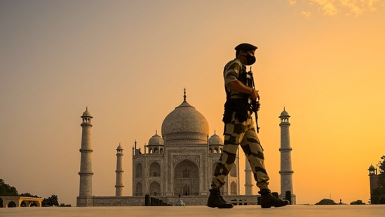 A soldier keeps watch at the Taj Mahal, in Agra on June 16. Last year, all monuments and sites maintained by the ASI were closed due to the Covid-19 pandemic on March 17. They reopened in July with strict restrictions like mandatory wearing of masks, a cap on the number of visitors and social distancing.(Money Sharma / AFP)