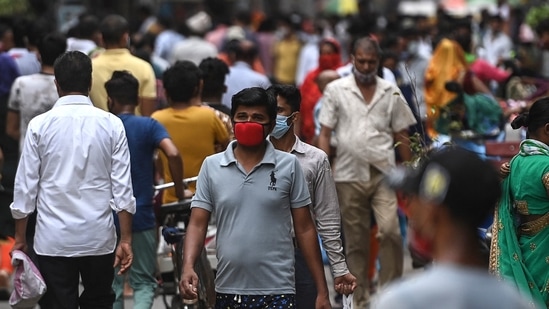 People shop at a market in Gurugram after the Haryana government eased restrictions as the number of new Covid-19 infections dropped(AFP) People shop at a market in Gurugram after the Haryana government eased restrictions as the number of new Covid-19 infections dropped(AFP)