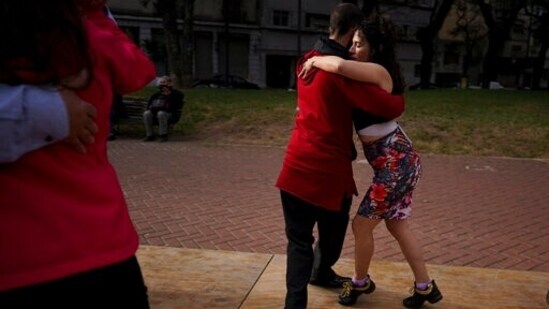 In this June 6, 2021 file photo, a couple dances tango at a park amid the Covid-19 pandemic lockdown in Buenos Aires, Argentina. Nostalgia for dance makes many tango dancers, or tangueros, defy restrictions with clandestine milongas in closed places or public spaces.(AP)