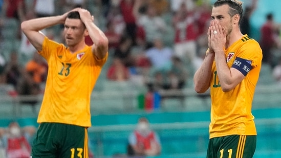 The faces say it all. Gareth Bale was brought down inside the area but he failed to double Wales' lead by hitting the ball into the stands from the penalty spot.(AP)