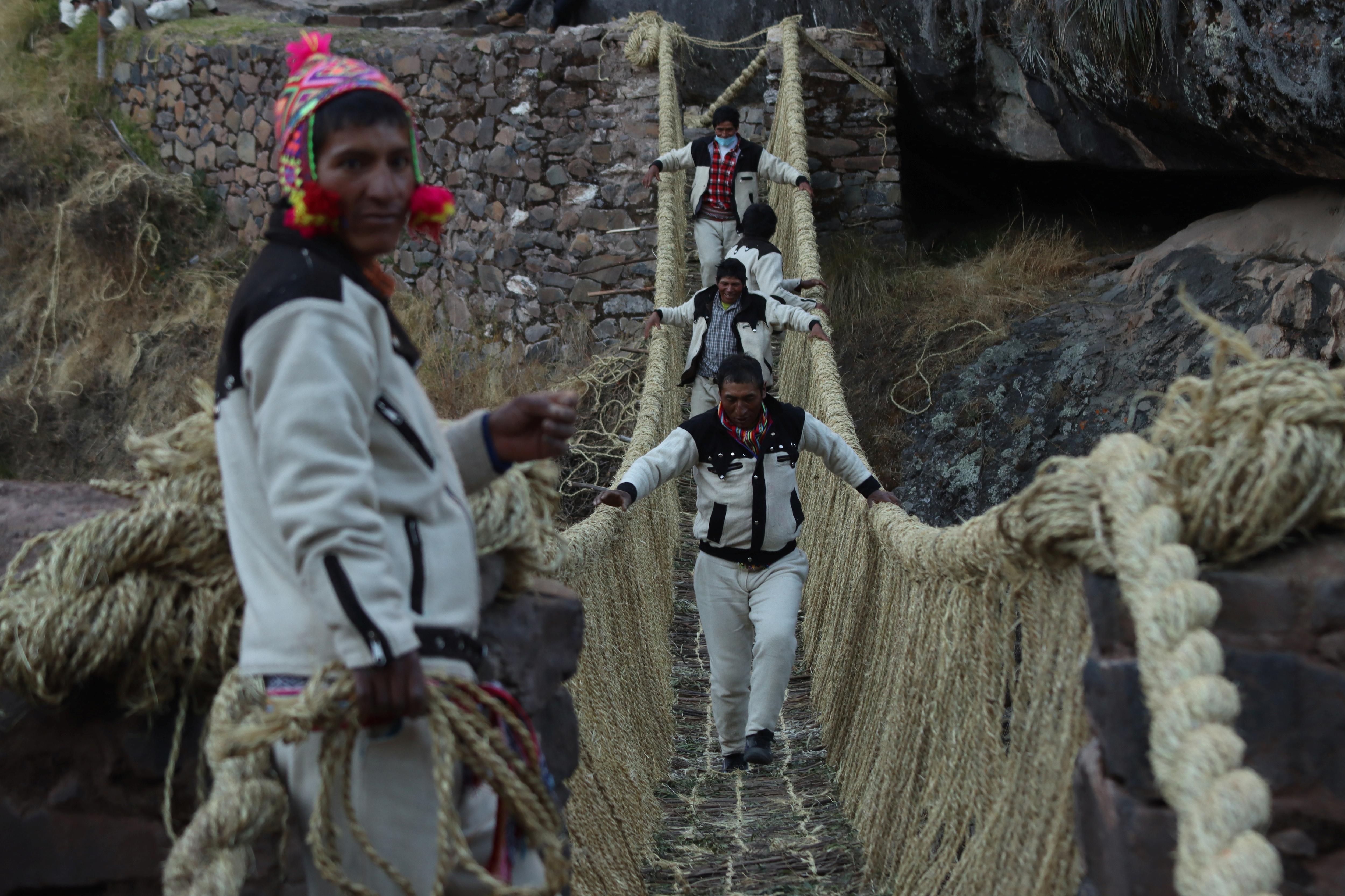 The Q'eswachaka bridge has been used for over 500 years to connect communities divided by the river. (via Reuters)