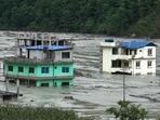 Houses submerged in floodwaters in Sindhupalchok, some 70 km northeast of Nepal's capital Kathmandu on June 16. As many as 20 people including three Indians have gone missing after floods triggered by heavy rains struck Sindhupalchok district in central Nepal, a government official told ANI.