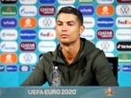 Cristiano Ronaldo removed two Coca-Cola bottles as he said 'Agua' (Portuguese for water), urging people to drink water instead, at his press conference on Monday.(Reuters Photo.)