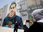 Israeli barrier with a mural depicting Eyad al-Halaq, an unarmed and autistic Palestinian who was shot dead by Israeli police in West Bank.