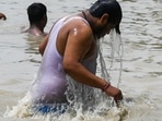 People take a dip in the Ganga Canal during a hot summer day in Muradnagar in Ghaziabad on June 16, 2021. (Representational)(AFP) People take a dip in the Ganga Canal during a hot summer day in Muradnagar in Ghaziabad on June 16, 2021. (Representational)(AFP)