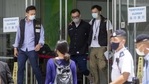Cheung Chi-wai, deputy editor at the Apple Daily newspaper, center, is escorted from the publication's headquarters building by officers with the Hong Kong Police Force's national security department in Hong Kong, China, on Thursday.(Bloomberg) Cheung Chi-wai, deputy editor at the Apple Daily newspaper, center, is escorted from the publication's headquarters building by officers with the Hong Kong Police Force's national security department in Hong Kong, China, on Thursday.(Bloomberg)