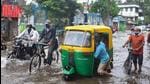 A driver tries to pull his three-wheeler out of a waterlogged street after heavy rain in Kolkata onThursday, June 17. (PTI) A driver tries to pull his three-wheeler out of a waterlogged street after heavy rain in Kolkata onThursday, June 17. (PTI)
